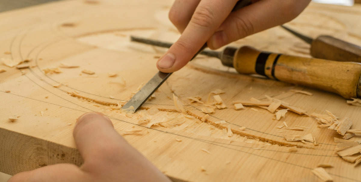 Artisan hand-carving wood